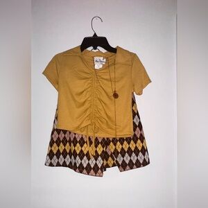 Causal two piece skirt set with gold chain accessory.